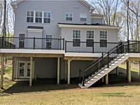 <b>Trex Transcend Island Mist Decking with Black Ultralox Aluminum Railing and White VInyl Fascia around perimeter of deck in Arnold MD</b>